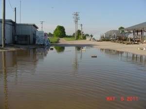 Water in the road near old barn & soil